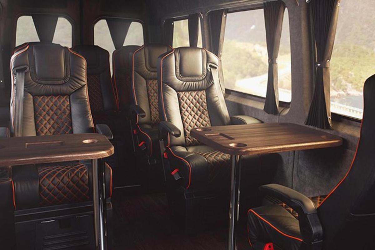 a van with chairs and a table in it