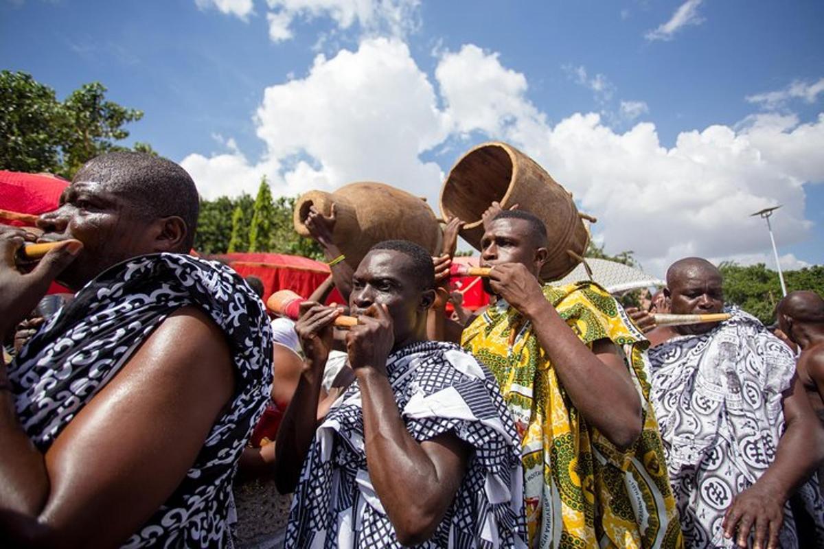 a group of men playing instruments in a crowd