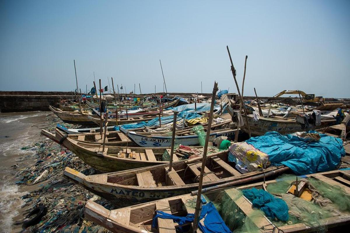 a group of boats sitting on top of a beach