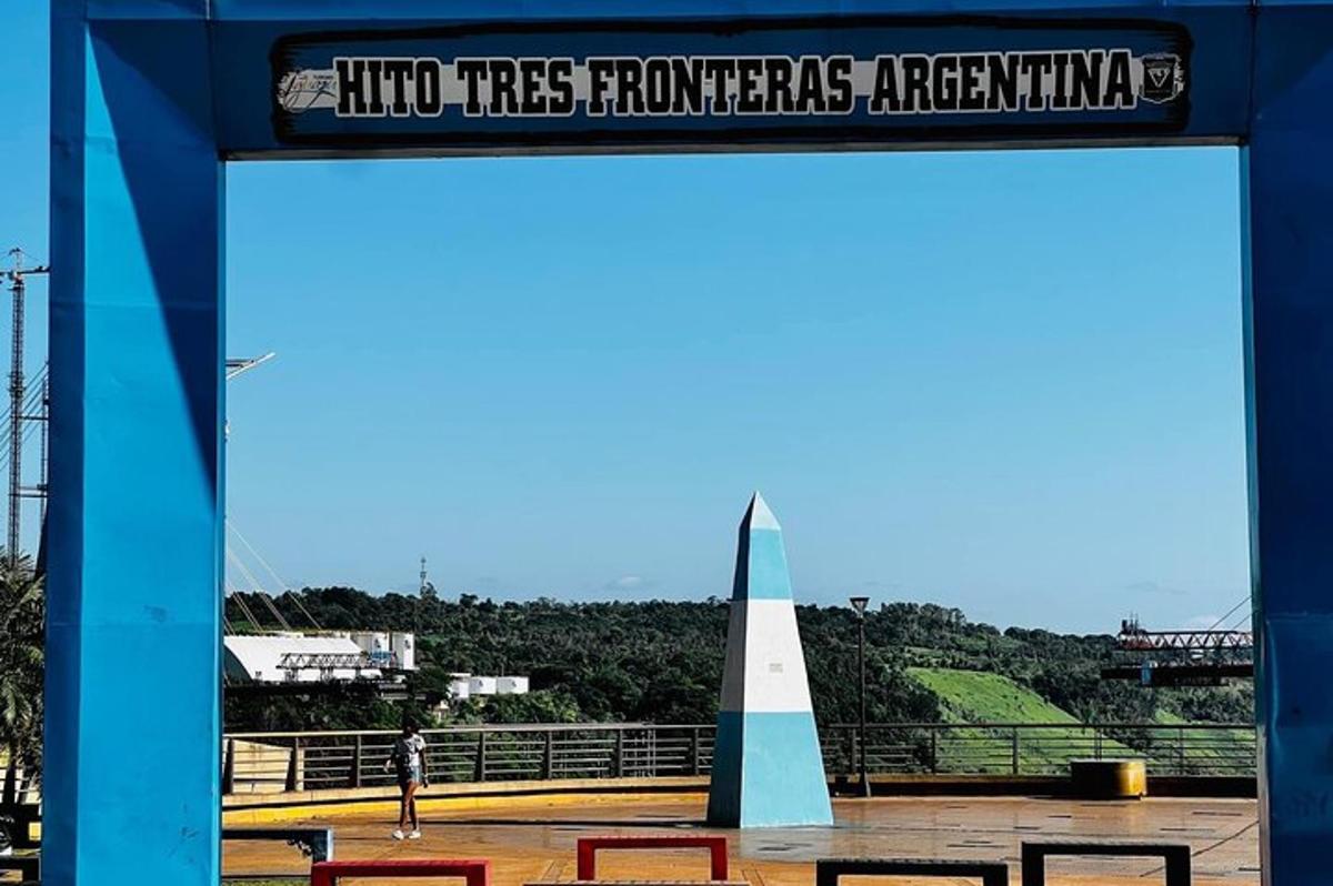 a sign that reads into trees transforming argentina and a monument