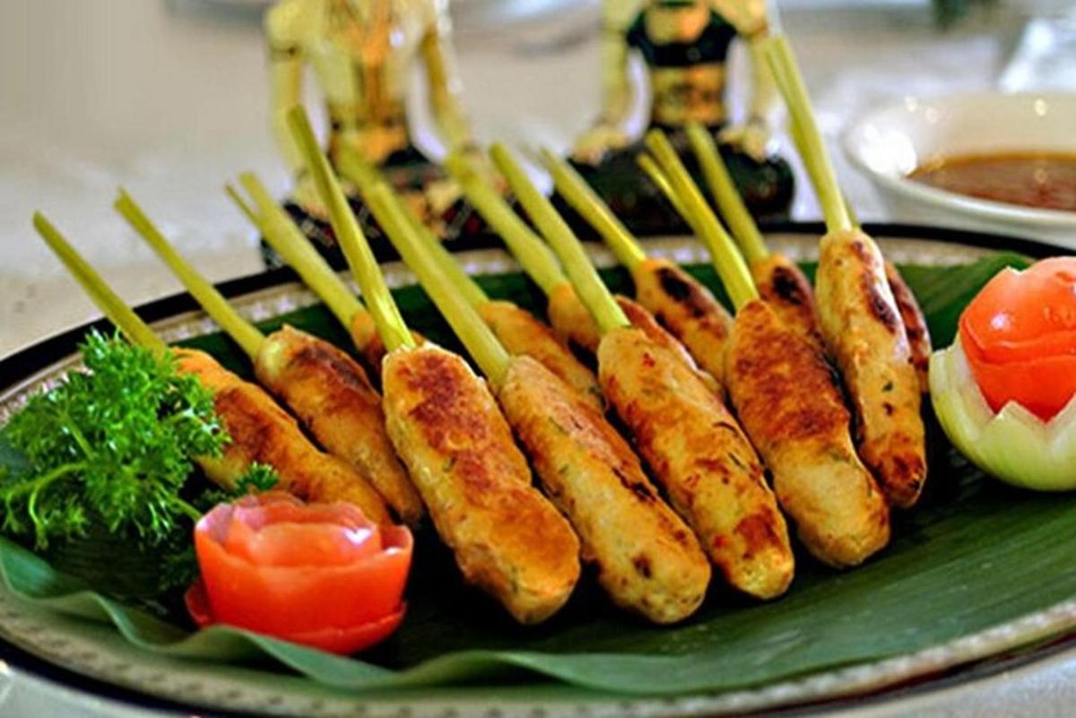 a plate of food with carrots and vegetables on a plate
