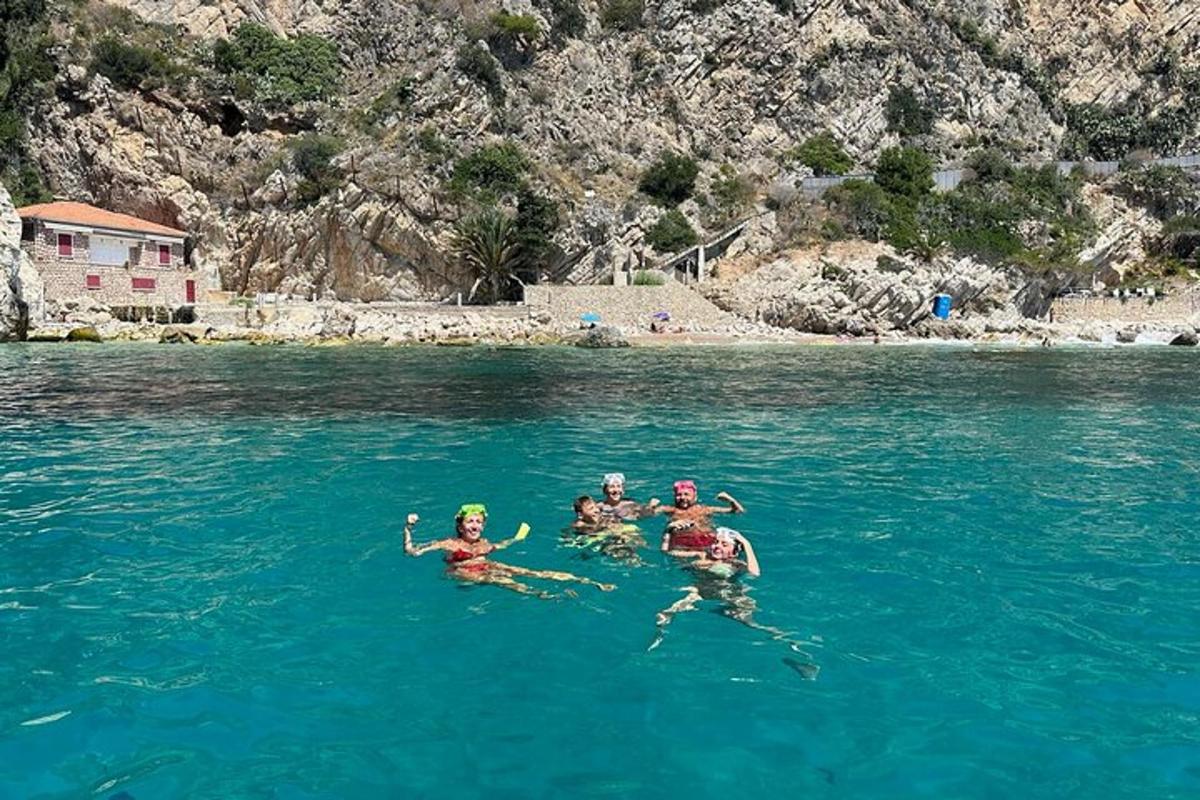 a group of people swimming in a body of water