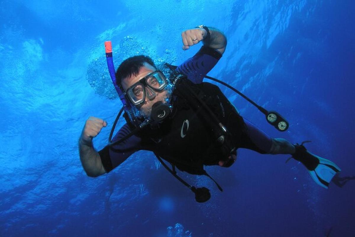 a man in a diving suit in the water