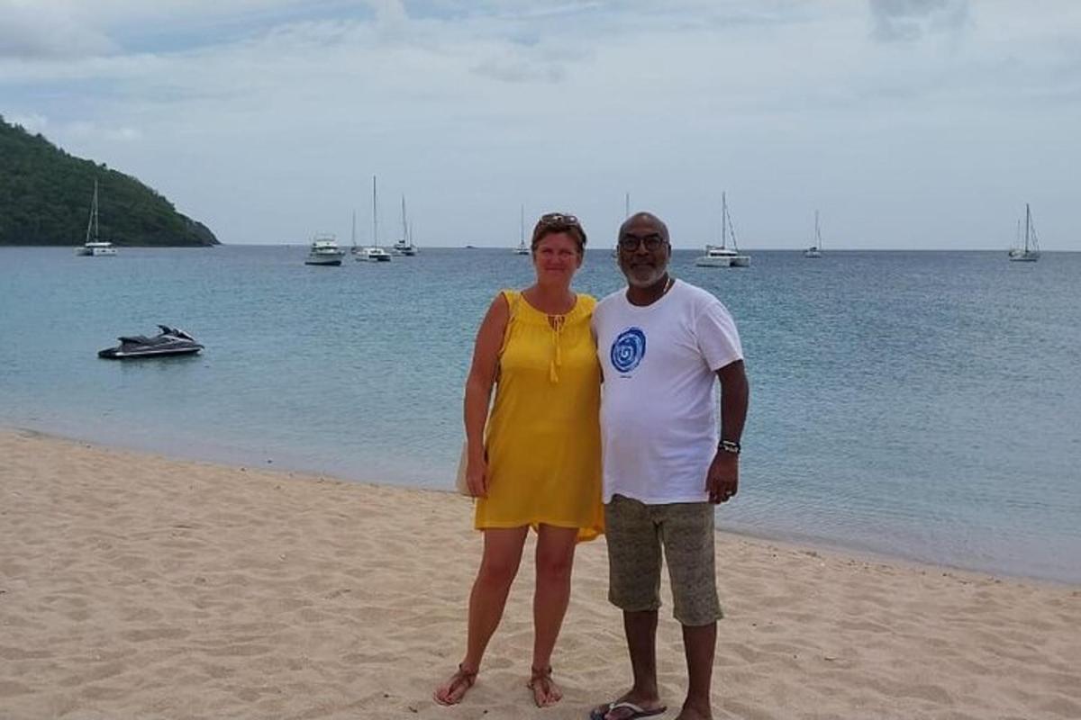 a man and a woman standing on the beach
