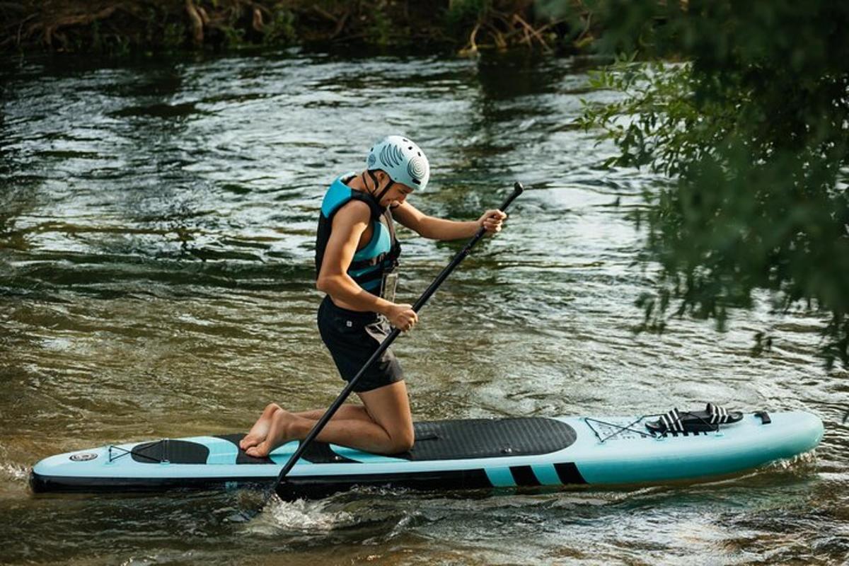 a woman on a paddle board in the water