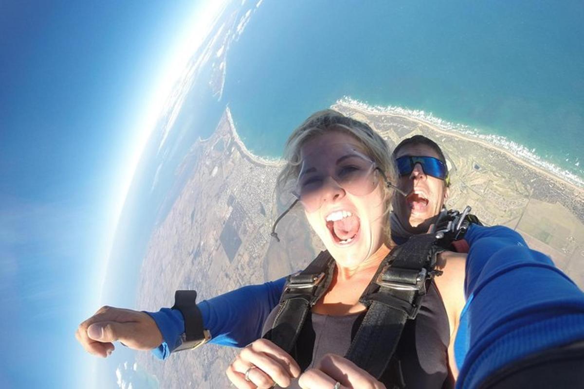 a man and a woman flying a plane