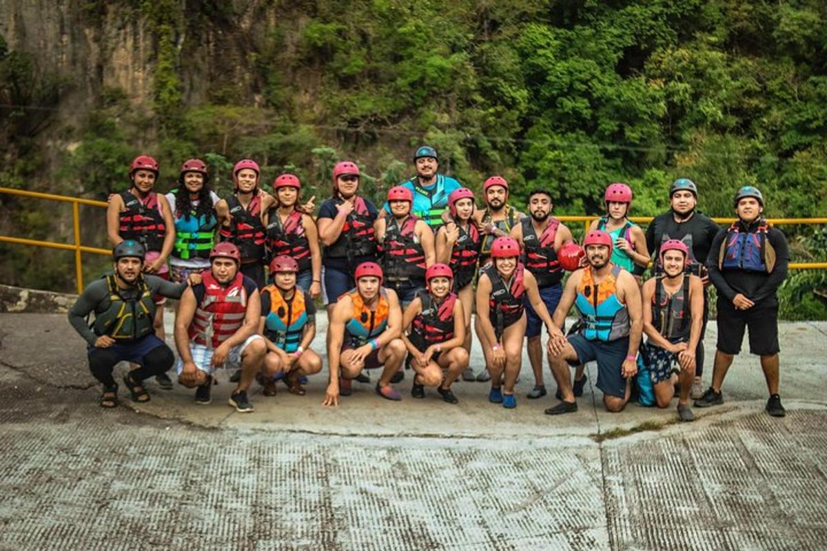 a group of people posing for a picture on a bridge