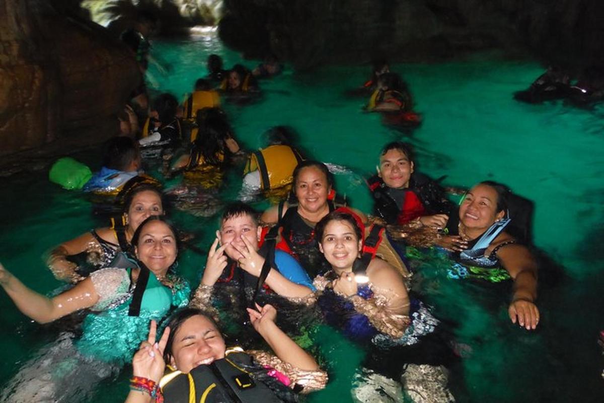 a group of people in the water on a raft
