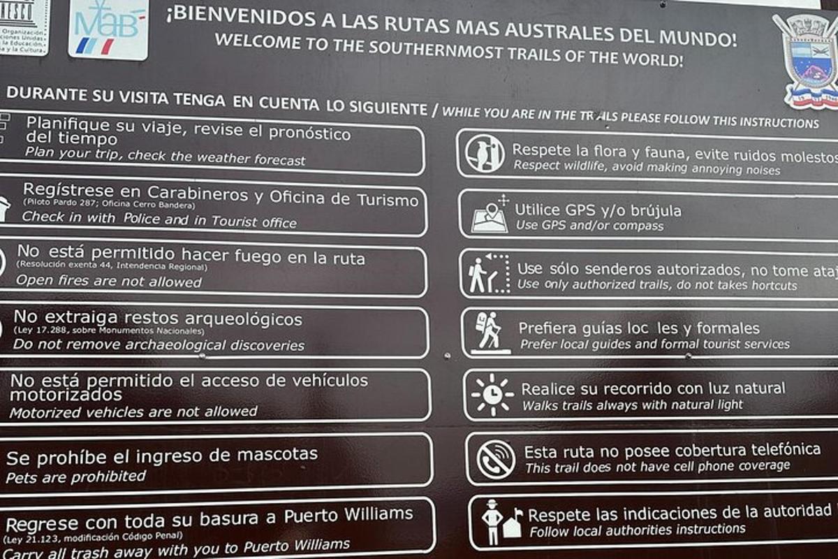a sign for the restrooms at a bus stop