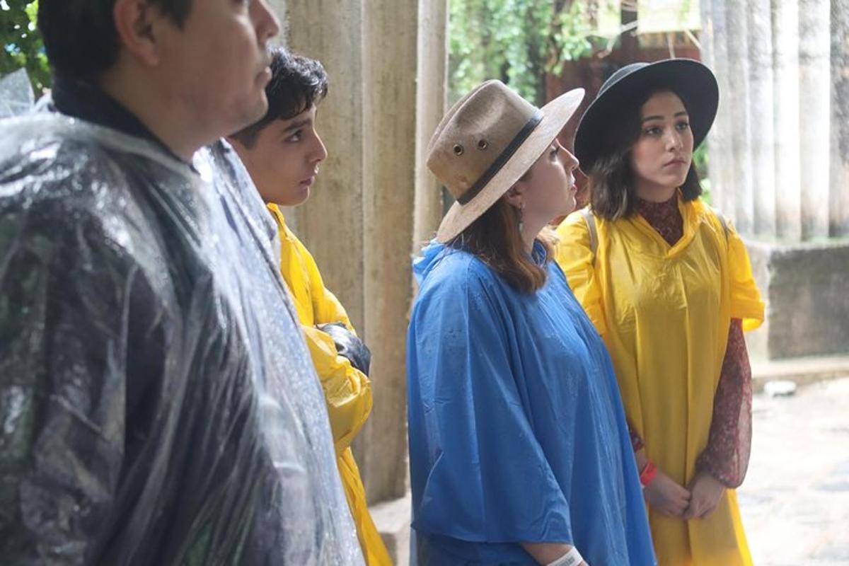 a group of people standing next to a man