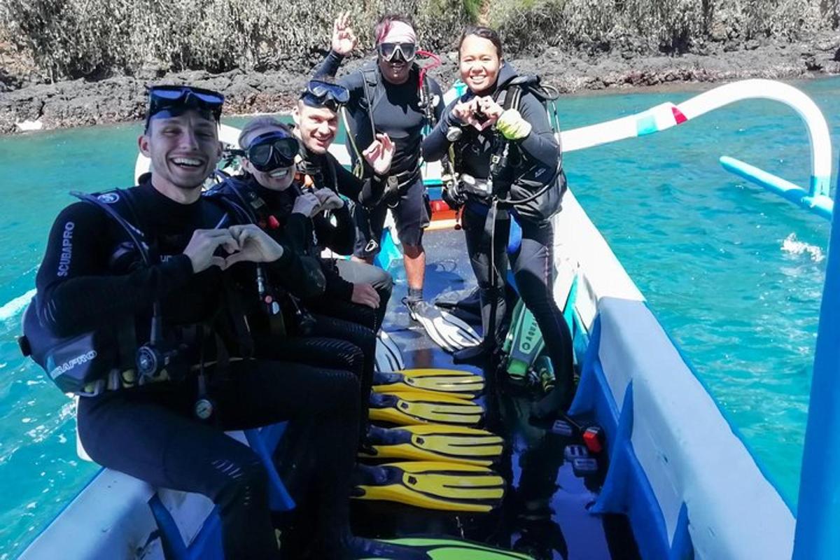a group of people on a boat in the water