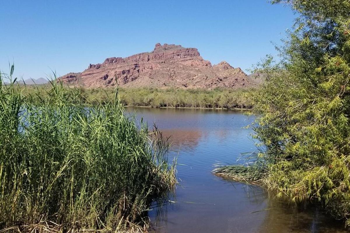 a river with a mountain in the background