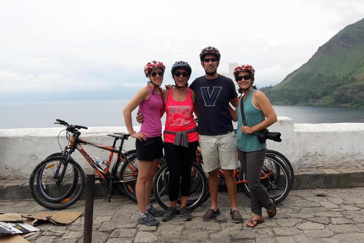 a group of people standing on a wall with bikes