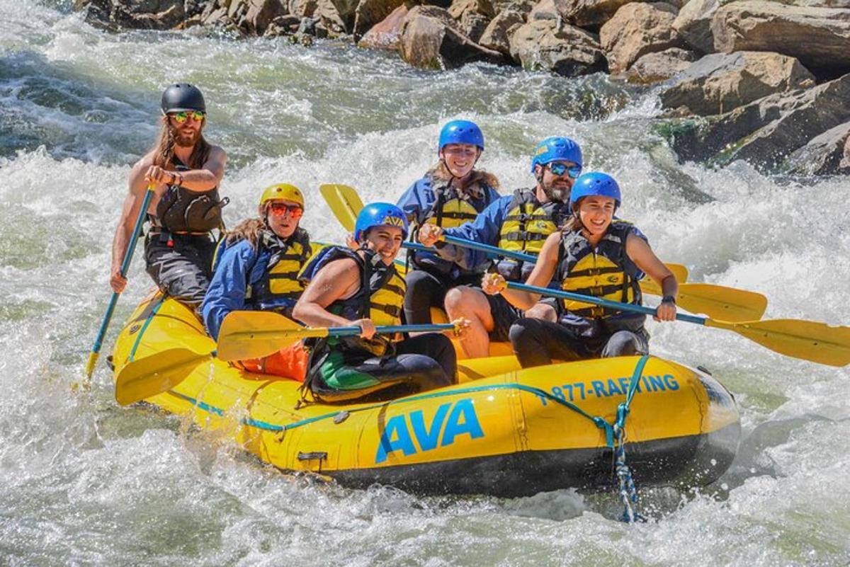 a group of people in a raft on a river