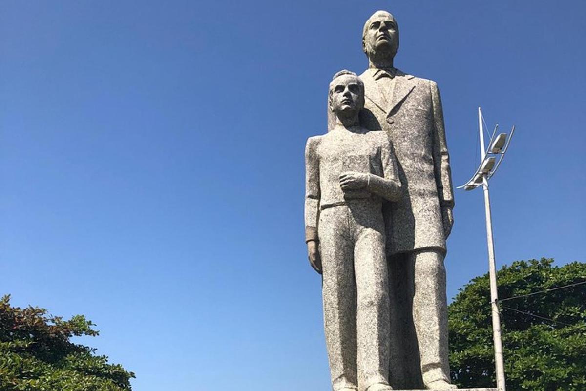 a statue of a man and a woman on top