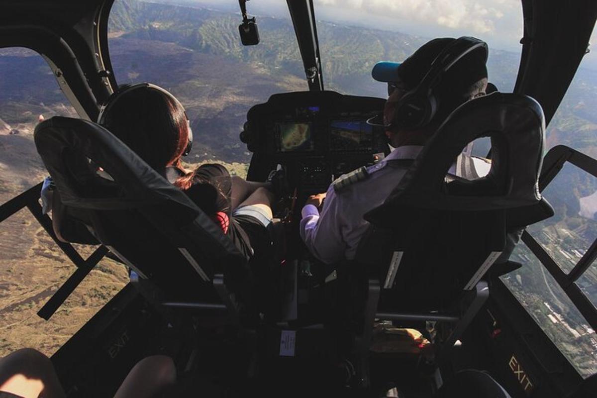 a group of people sitting in the cockpit of a helicopter