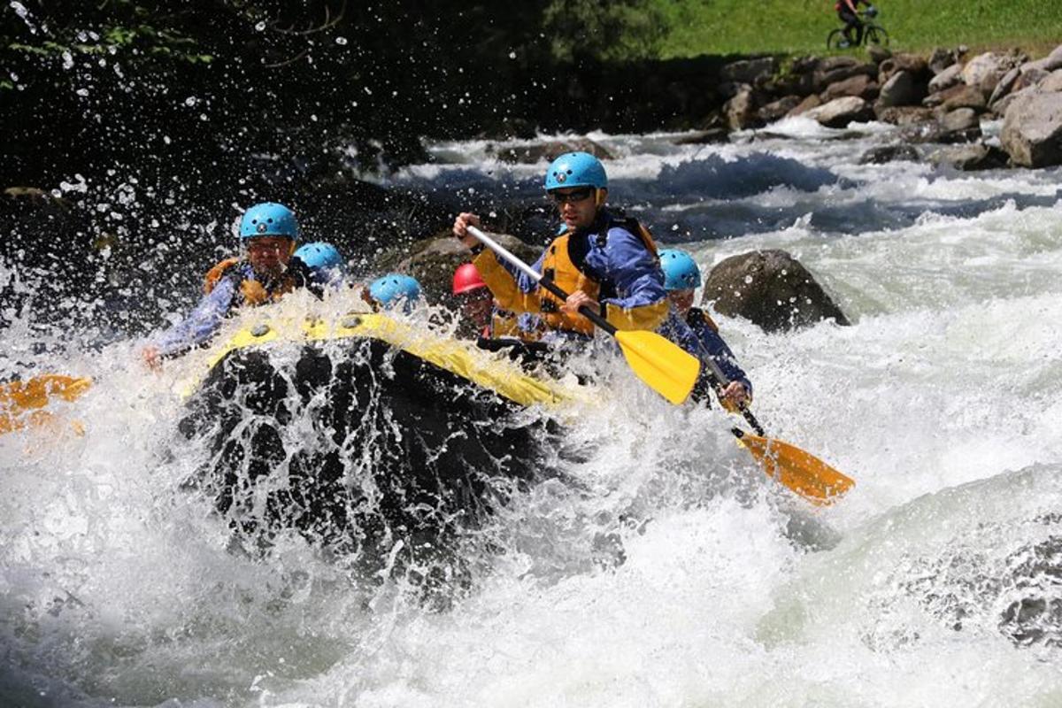 a group of people on a raft in a river