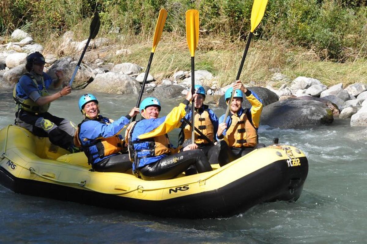 a group of people in a raft on a river