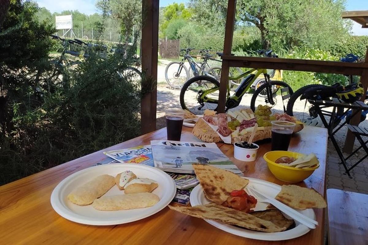 a wooden table with two plates of food on it