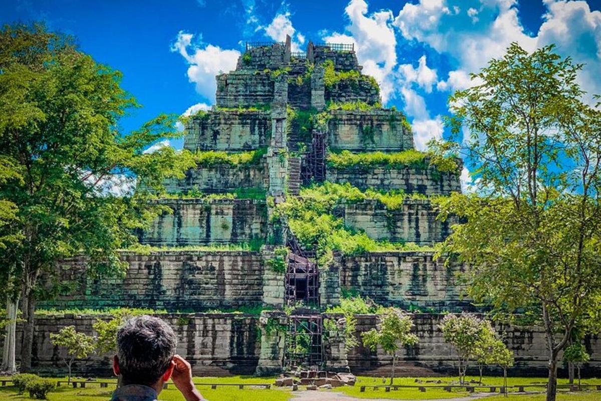 a man taking a picture of a temple
