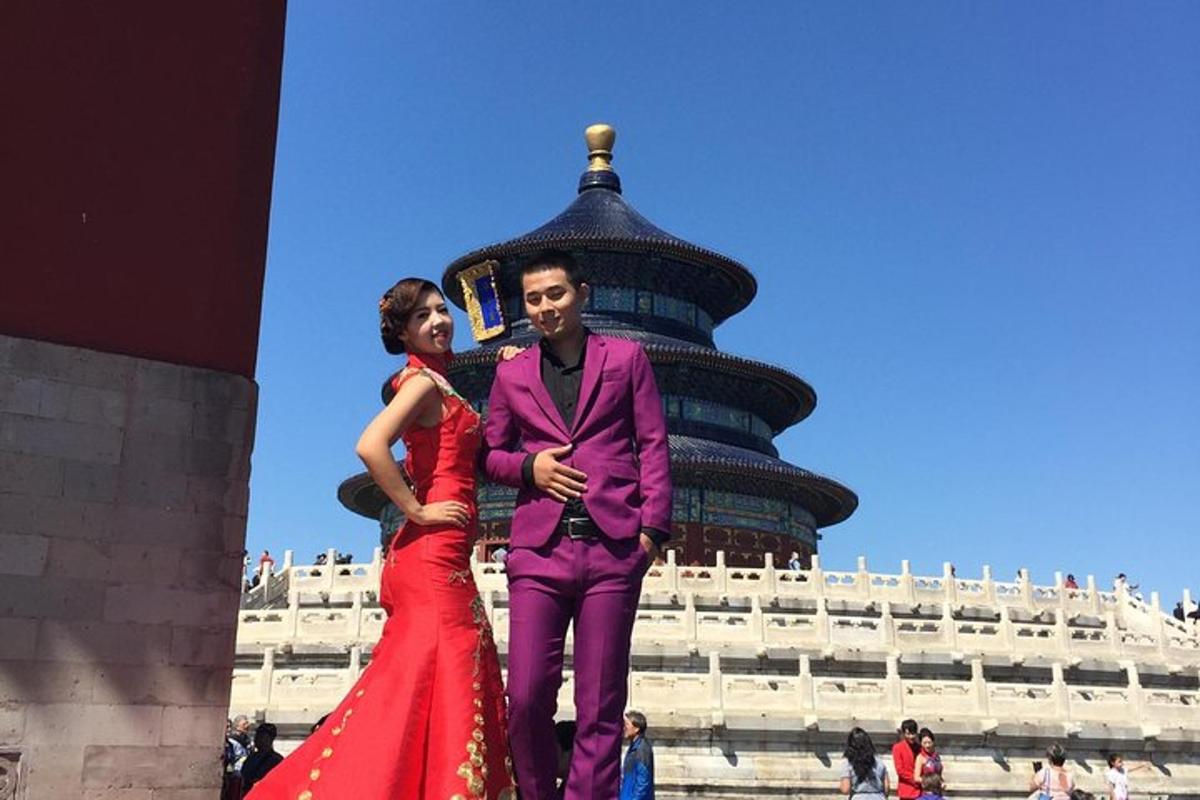a man and a woman standing in front of a building