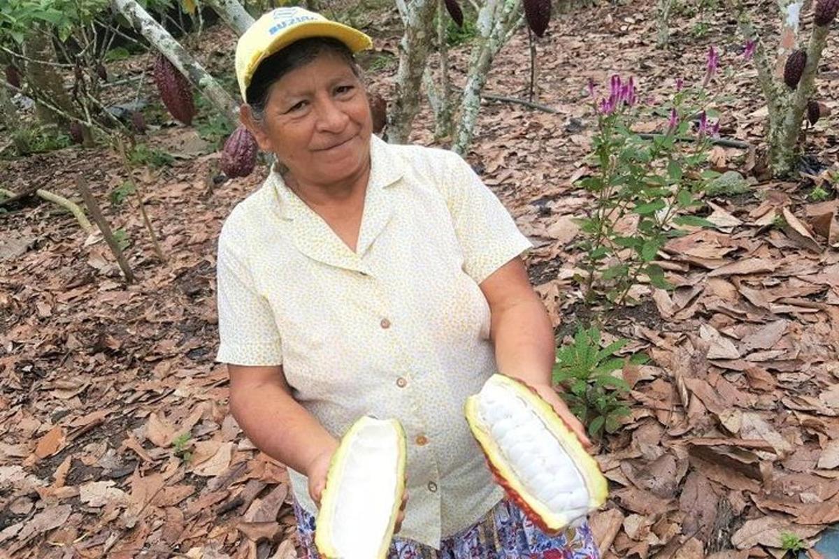 a woman is holding two bananas in her hands