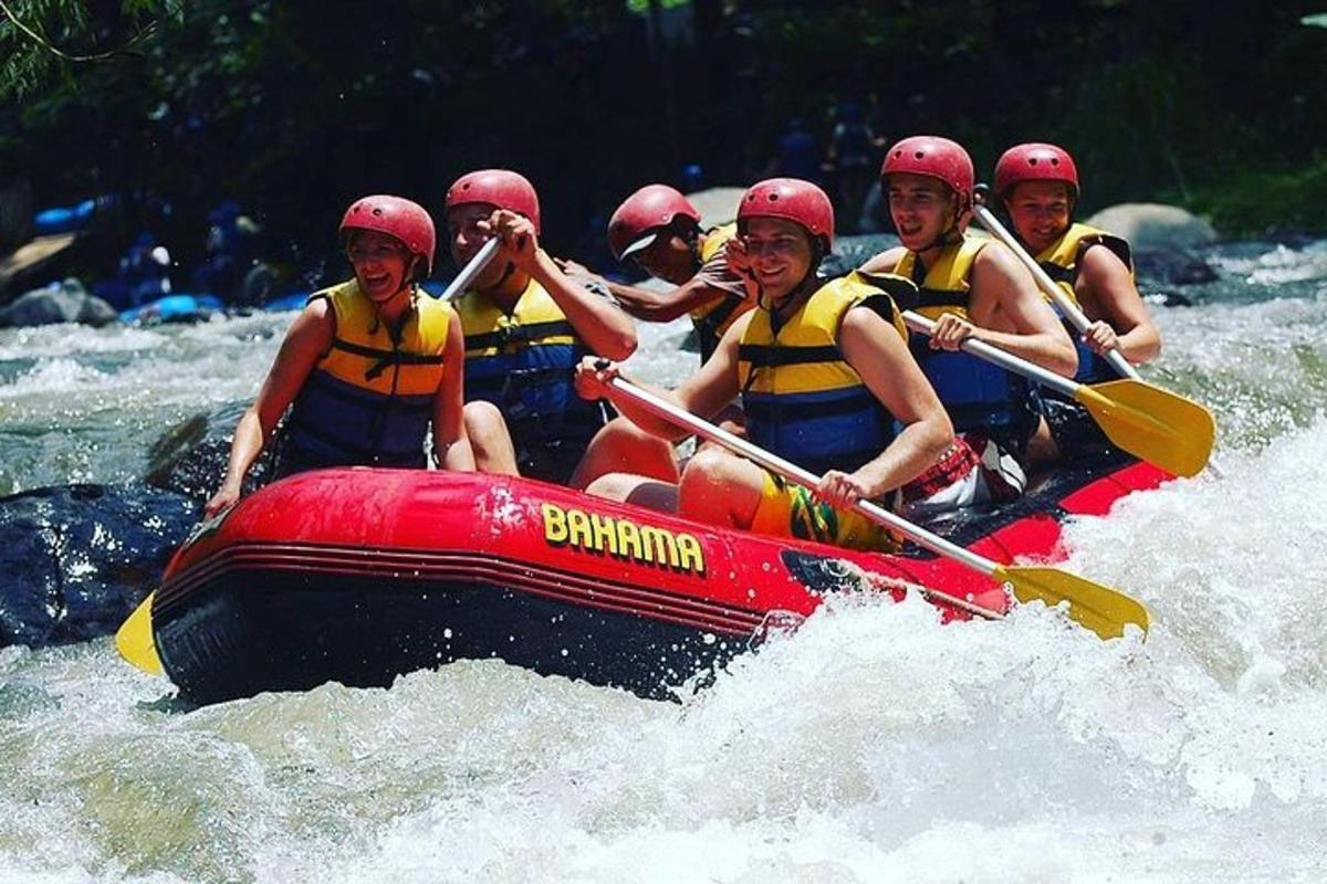 a group of people in a raft in the water