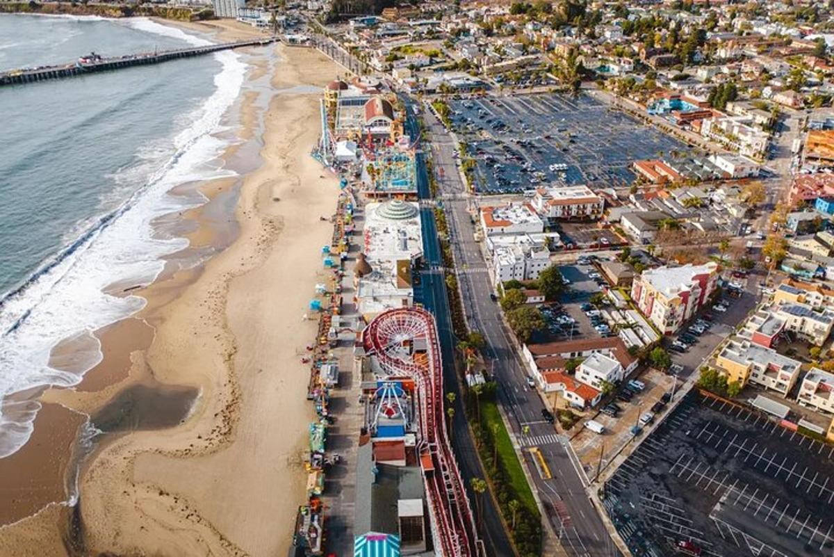an aerial view of a beach with a roller coaster