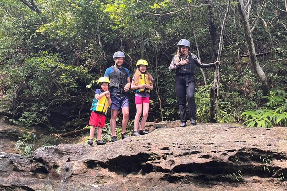 a group of people standing on top of a rock