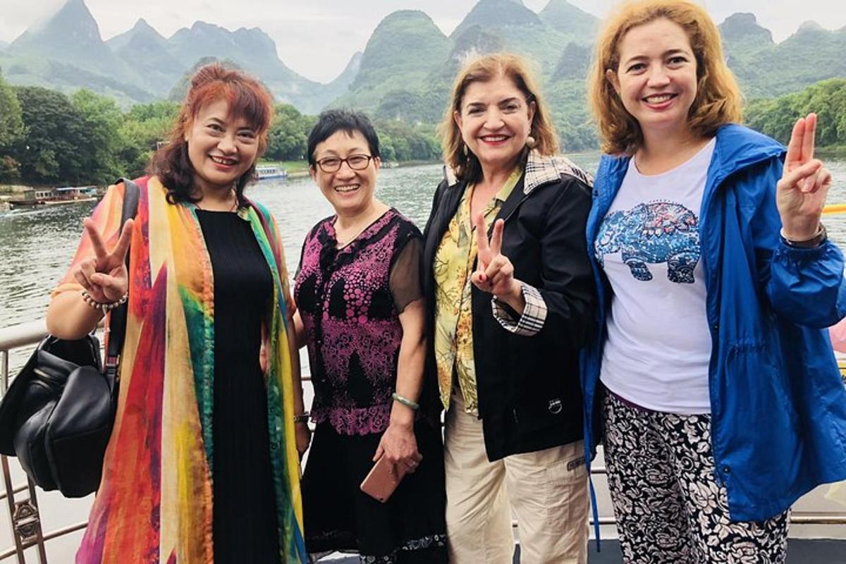 a group of women standing on a boat