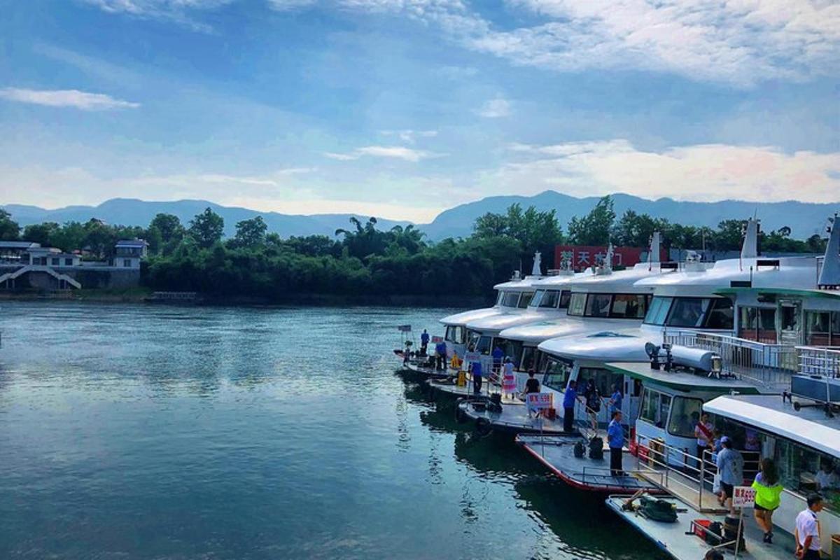 a group of boats docked on a river