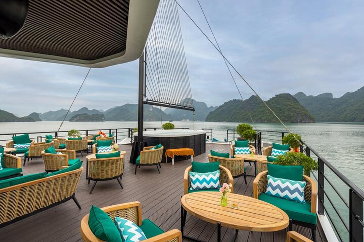 a deck on a cruise ship with chairs and tables