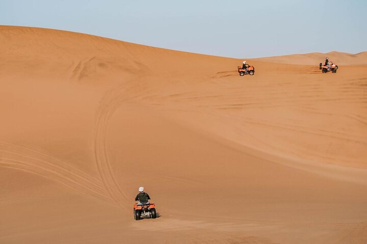 a group of people riding motorcycles in the desert