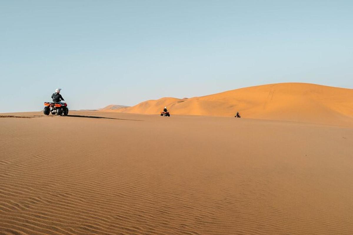 a group of people riding motorcycles in the desert