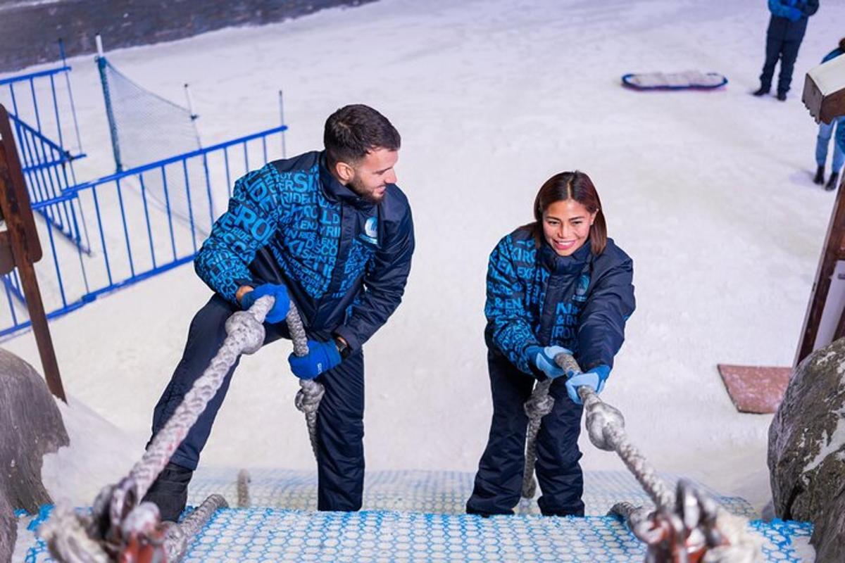 a man and a woman are pulling a rope