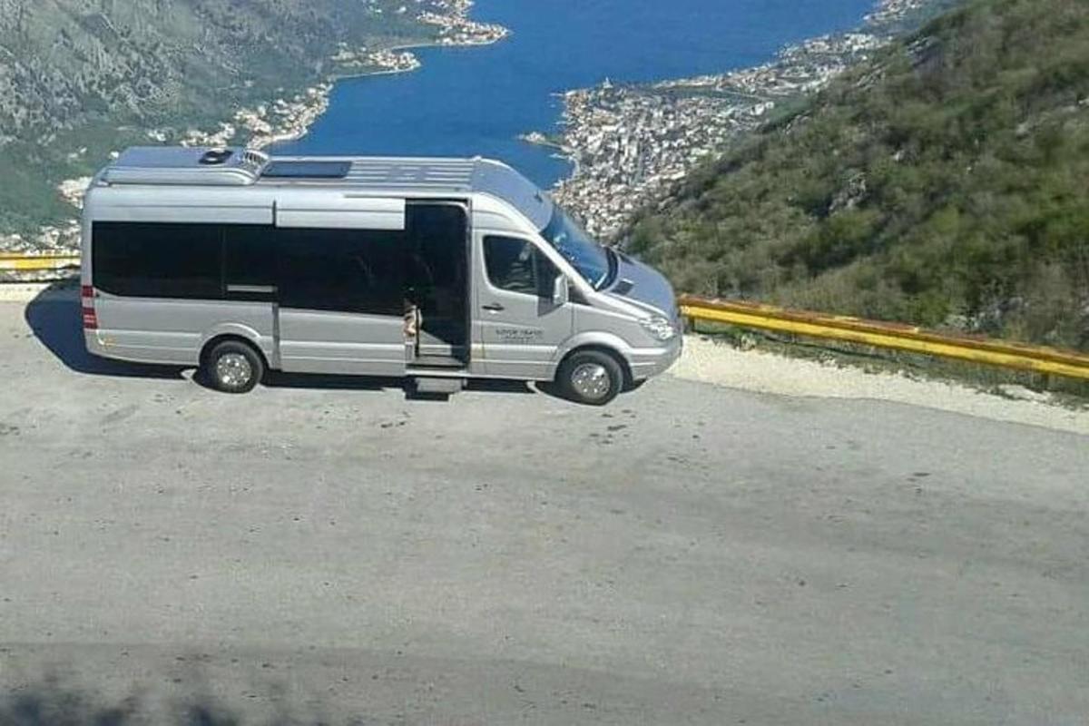 a silver van parked on the side of a road