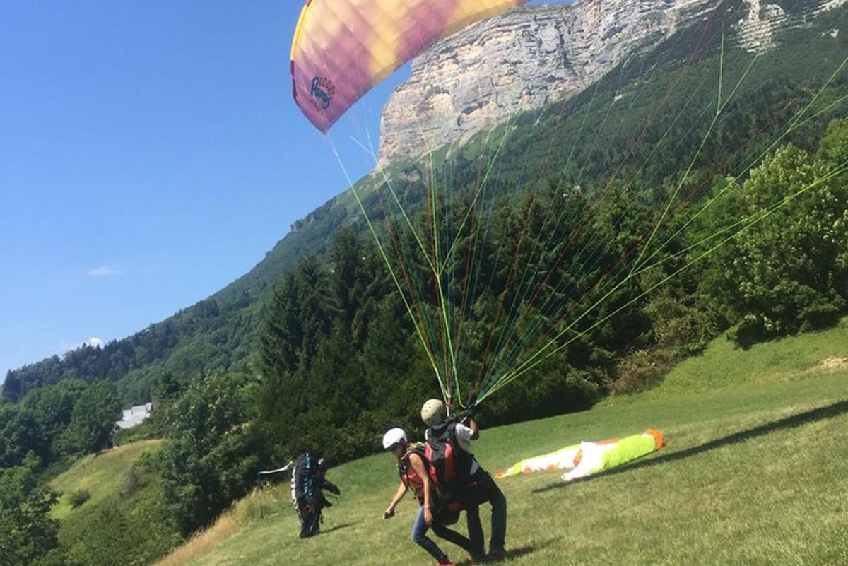 two people are flying a kite in a field