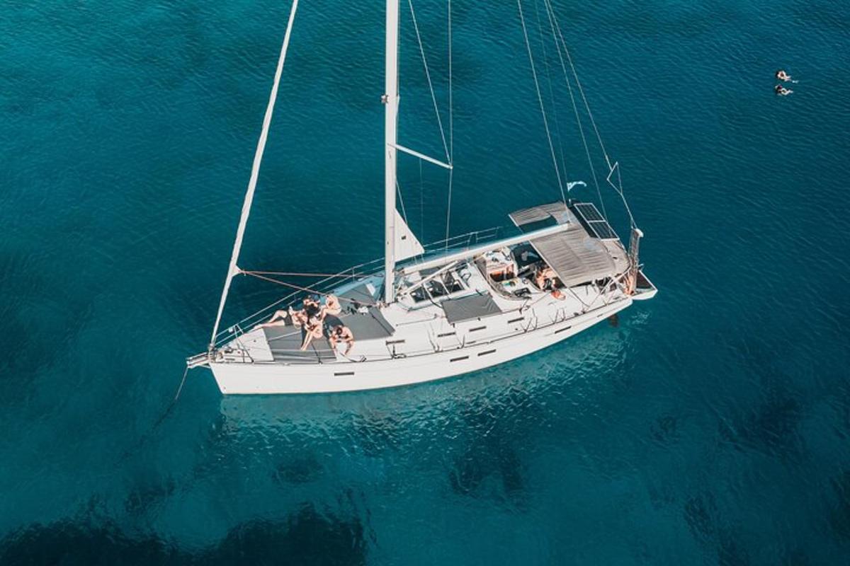 an overhead view of a sailboat in the water