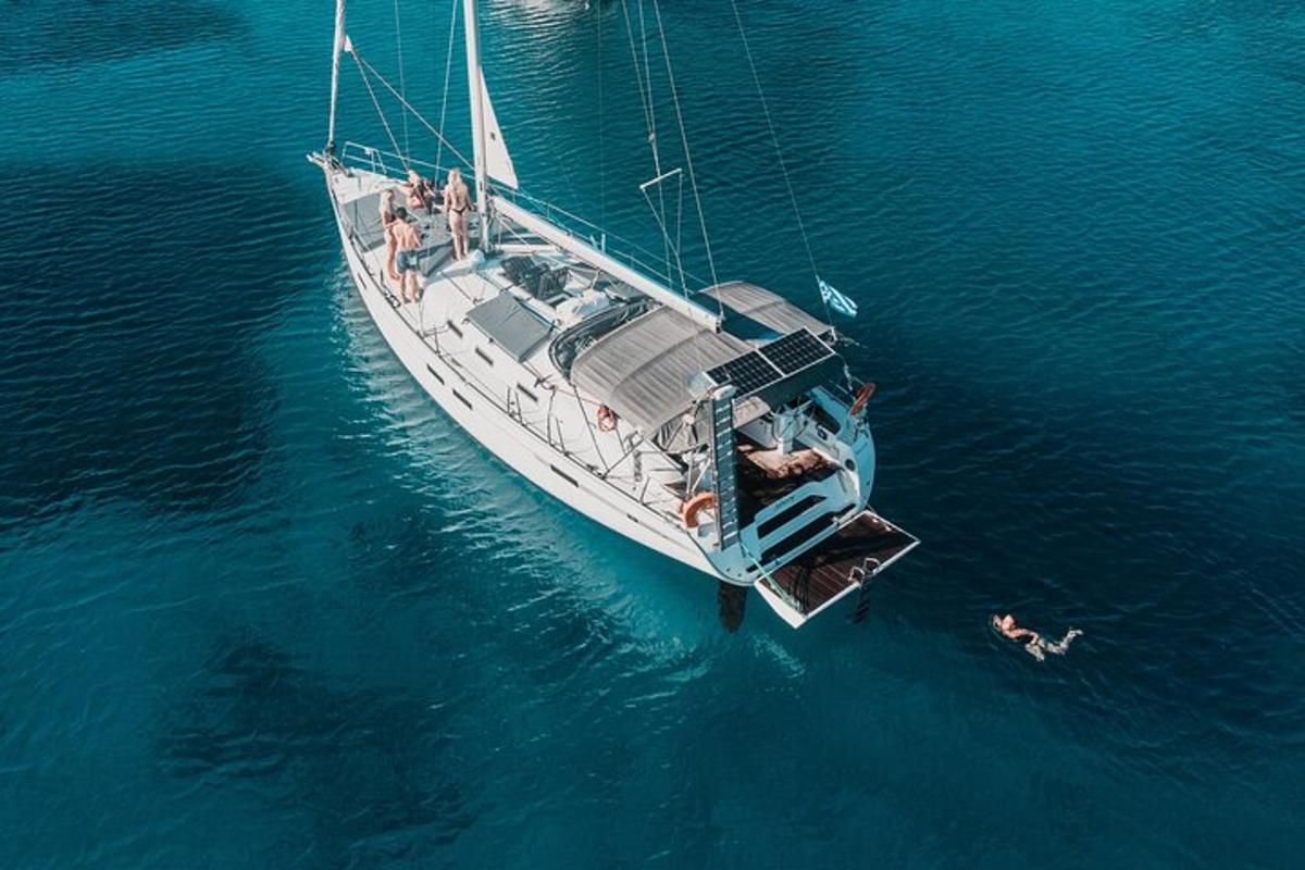 a group of people on a sail boat in the water