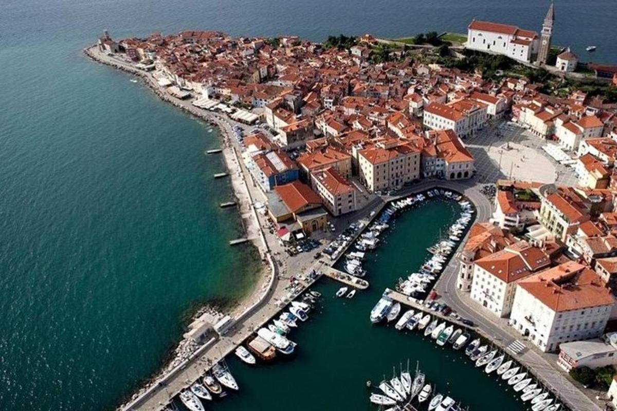 an aerial view of a harbor with boats in the water