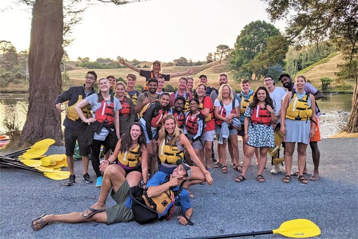 a group of people in life jackets posing for a picture