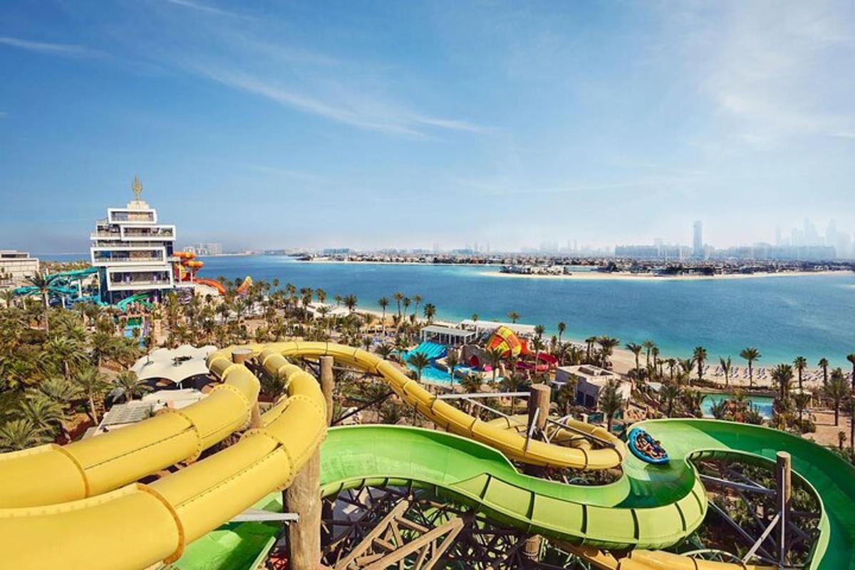 a water park with a water slide on the beach