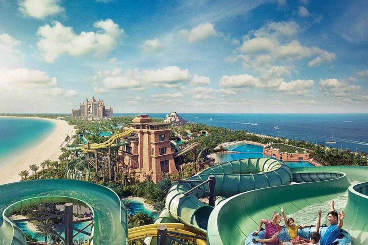 a group of people on a water slide at a water park