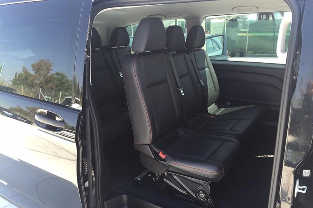 an open back seat of a car with the back seat up