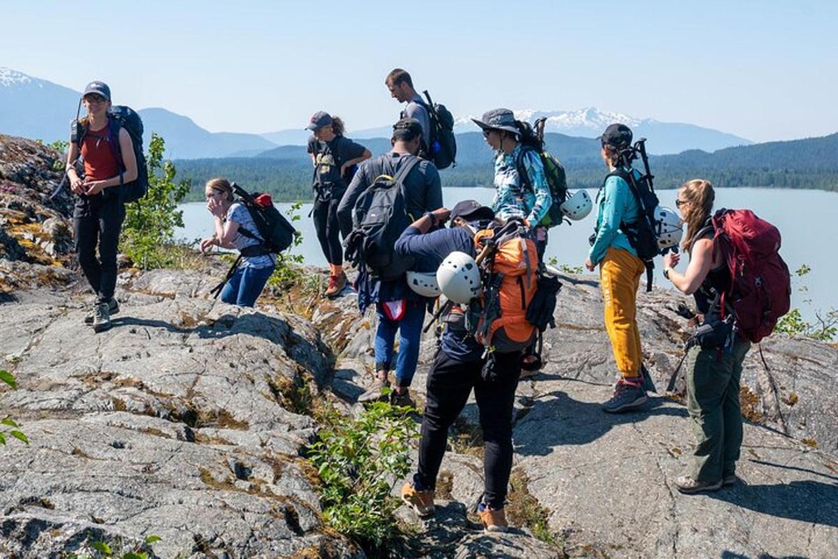 a group of people standing on a rocky mountain