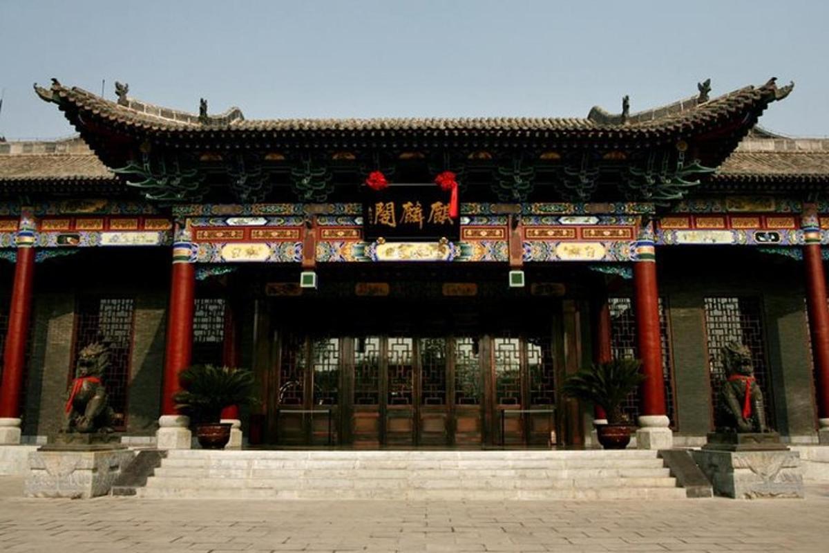 a building with red columns in front of it