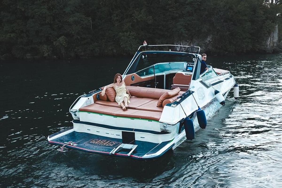 a man sitting on a boat in the water