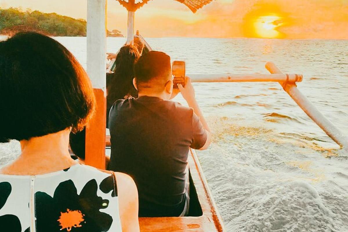 a man taking a picture of a person on a boat