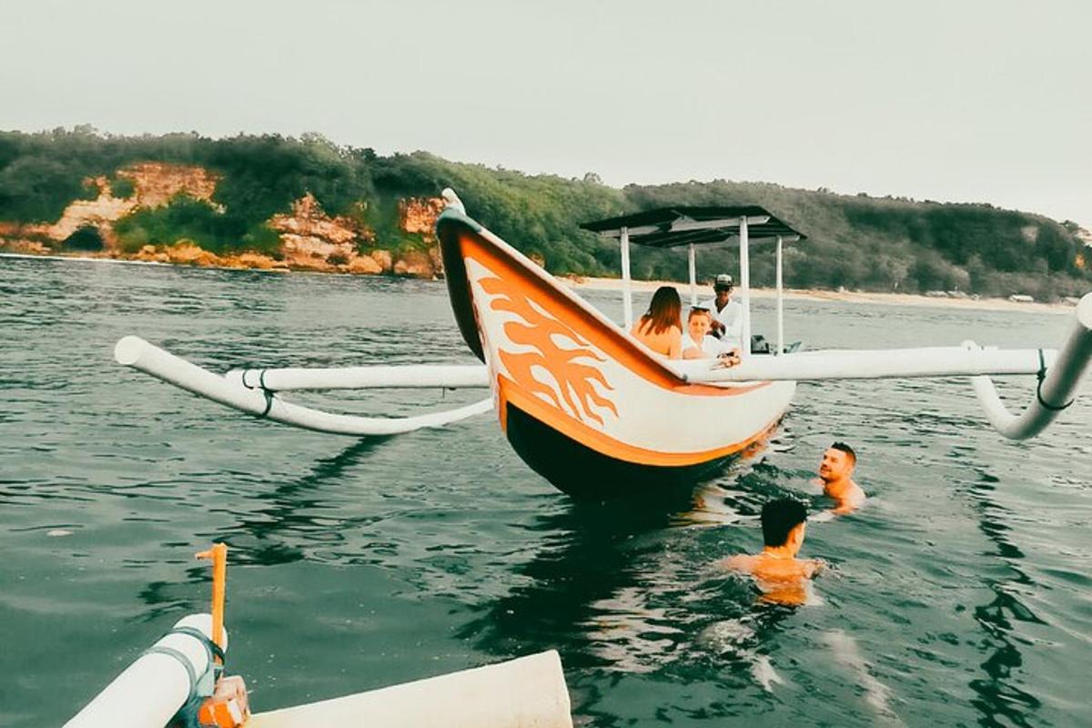 a group of people on a boat in the water