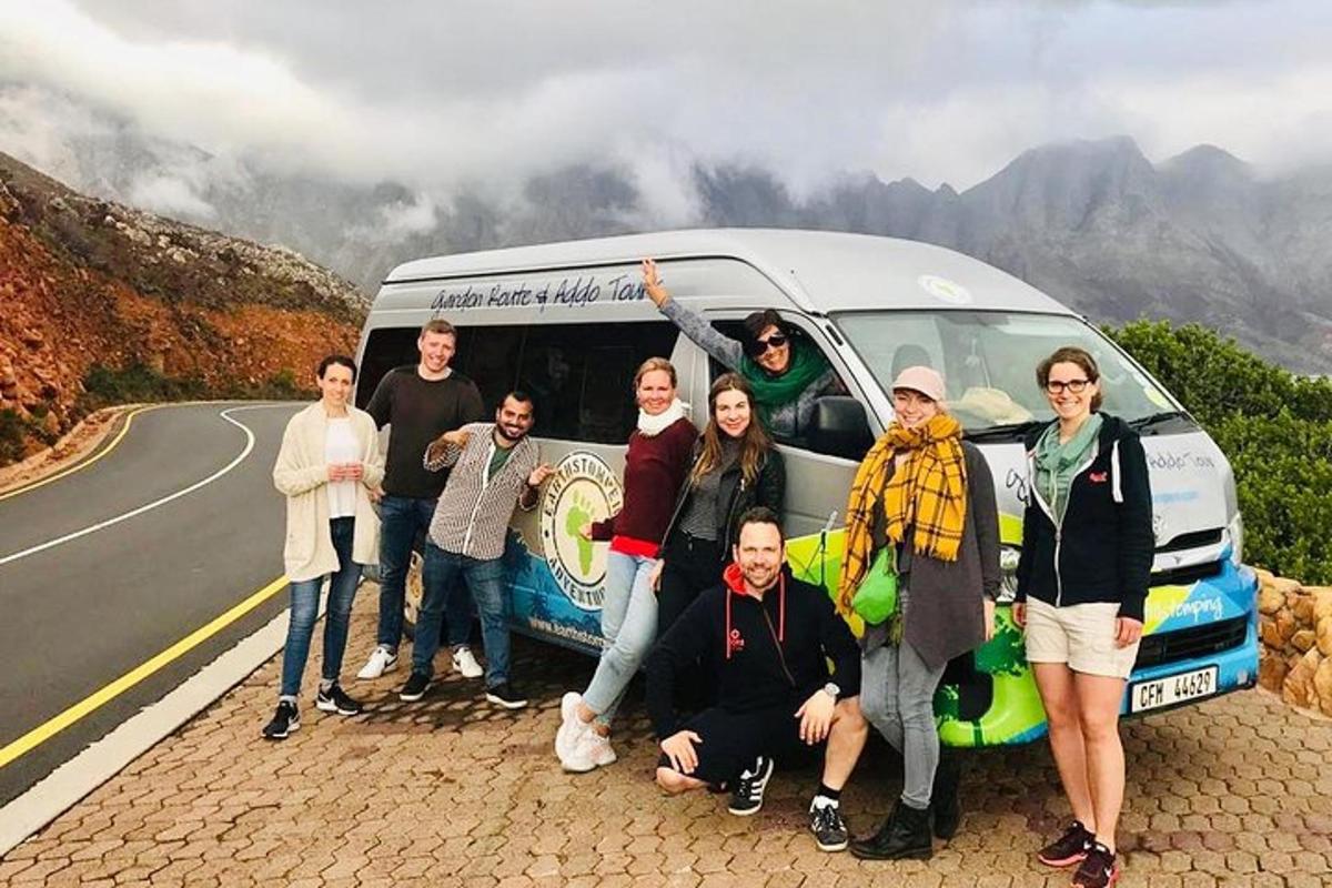 a group of people standing in front of a van